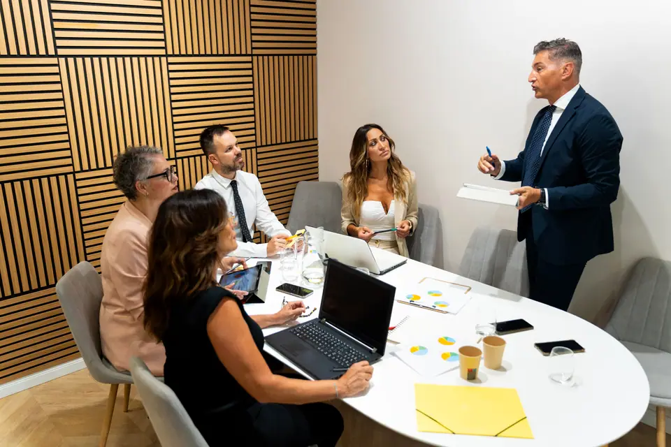 Business owners in a working session around a meeting table